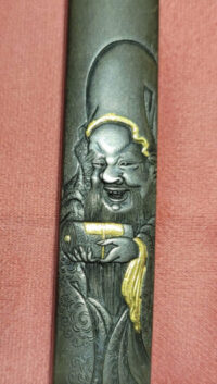 A man carved on the scabbard of Japanese Katanas